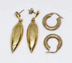 A pair of Victorian style torpedo shaped drop earrings, marked '9ct', length 35mm, and another