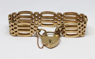 A hallmarked 9ct gold gate bracelet, heart shaped padlock clasp, length 16cm, wt. 29.1g.