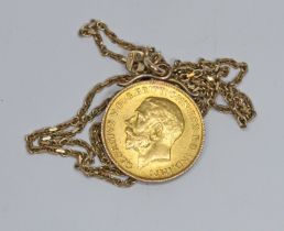 A George V half sovereign, yellow metal pendant mount, chain marked '375', gross weight 7.6g.