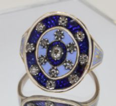 A Georgian blue enamel and diamond ring, the oval measuring approx. 20mm x 17mm and set with fifteen