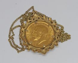 A George V 1911 sovereign, hallmarked 9ct gold pendant mount and chain marked '9c', gross weight