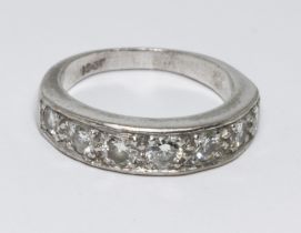 A seven stone diamond ring, total approx. diamond weight 0.80cts, white metal band marked '18ct',