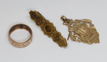 Three pieces of 9ct gold comprising a brooch, a fob and a ring, gross weight 11.4g, as found.