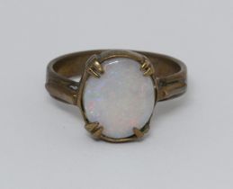 An opal cabochon ring, yellow metal unmarked, gross weight 3.3g, size P.