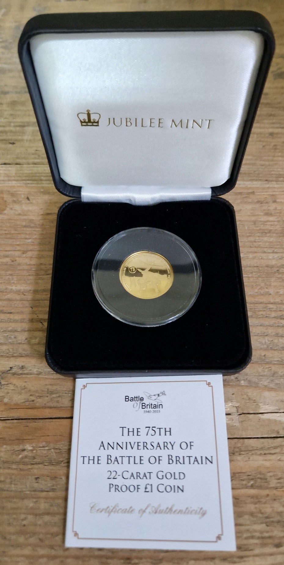 A Jubilee Mint 'THE 75TH ANNIVERSARY OF THE BATTLE OF BRITAIN 22-CARAT GOLD PROOF £1 COIN',