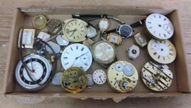 A tray of assorted watches and watch movements.