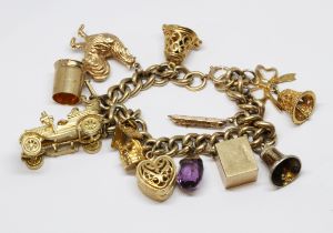 A 9ct gold charm bracelet, seven hallmarked 9ct gold charms, two unmarked and one indistinctly