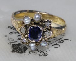 An antique blue paste and pearl ring, gross weight. 3.2g, size P. Condition - two pearls missing,