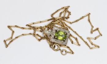 A hallmarked 9ct gold peridot pendant and chain, length 54cm, gross weight 7.1g.