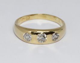 An antique three stone diamond ring, the old cut stones weighing approx. 0.30cts each, hallmarked