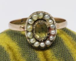 An antique split pearl and foiled back paste ring, the oval cluster measuring approx. 6mm x 10mm,