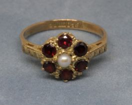 A hallmarked 9ct gold garnet and pearl cluster ring, gross wt. 2.5g, size M.