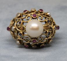 A multi-gem set ring, set with a central cultured pearl, further cultured pearls, rubies and