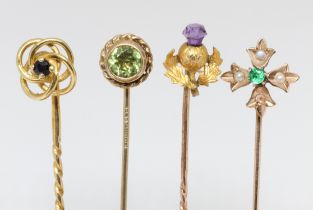 A group of four assorted stick pins; one hallmarked 18ct gold weight 1.9g, one hallmarked 9ct gold