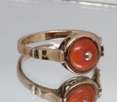 A Polish 14ct gold coral ring, gross wt. 3.7g, size N/O, with associated box. Condition - good,