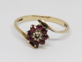 A hallmarked 9ct gold diamond and ruby ring, gross weight 1.3g, size M.