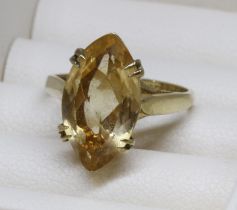 A hallmarked 9ct gold ring set with a marquise cut citrine, gross weight 3.2g, size J/K.