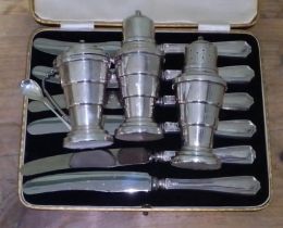 A 1930s vintage art deco silver cruet set, Davenport 1937 and a set of silver handled knives by