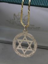 A hallmarked 9ct gold Star of David pendant on 58cm S link chain marked with 9ct gold import marks,