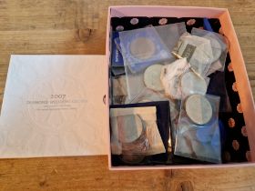 A box of assorted commemorative crowns & £5 coins