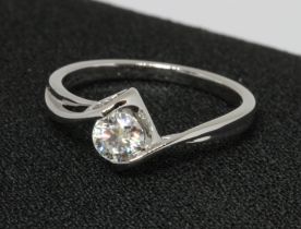 A lab grown diamond solitaire, white metal marked 'Au750', gross weight 2.3g, size P.