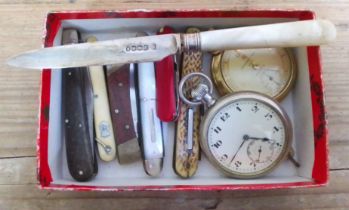 A box of pen knives and pocket watches.
