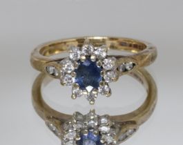 A hallmarked 9ct gold diamond and sapphire cluster ring, gross weight 3g, size K.