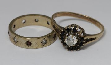 A hallmarked 9ct gold eternity ring and a cluster ring unmarked, gross weight 4.6g.