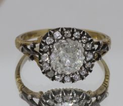 A Georgian diamond cluster ring, the central stone weighing approx. 1ct, surrounded by sixteen melee