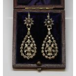 A pair of Georgian diamond earrings, each formed as a central scroll drop set with single diamond