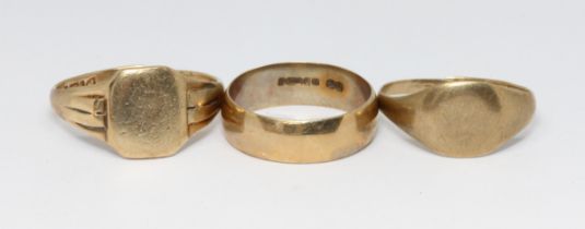 Two hallmarked 9ct gold rings and another unmarked,, gross weight 9.6g. Condition - both signet