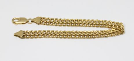 A double link bracelet with lobster claw clasp, 9ct gold import marks, length 18cm, weight 5.3g.