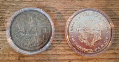 Two coins; A US 1oz fine silver dollar and a 1935 crown.
