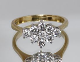 A diamond cluster ring, nine round brilliant cut diamonds weighing approx. 1ct in total,
