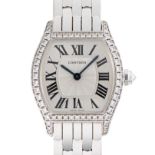 A FINE LADIES 18K SOLID WHITE GOLD & DIAMOND CARTIER TORTUE MECANIQUE BRACELET WATCH CIRCA 2000s,