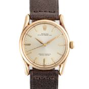 A GENTLEMAN'S SIZE 14K SOLID GOLD ROLEX OYSTER PERPETUAL WRIST WATCH CIRCA 1960, REF. 1010 WITH "