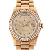 A FINE & RARE GENTLEMAN'S SIZE 18K SOLID GOLD, DIAMOND & RUBY ROLEX OYSTER PERPETUAL DAY DATE
