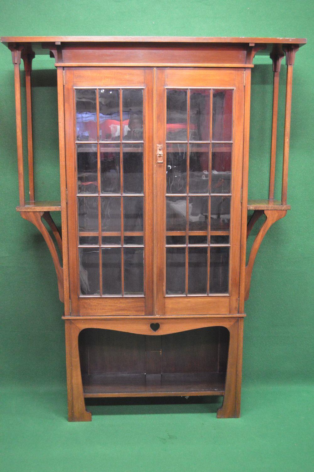 Arts & Crafts or Art Nouveau display bookcase/cabinet in the manner of Liberty & Co. - 53.5" wide