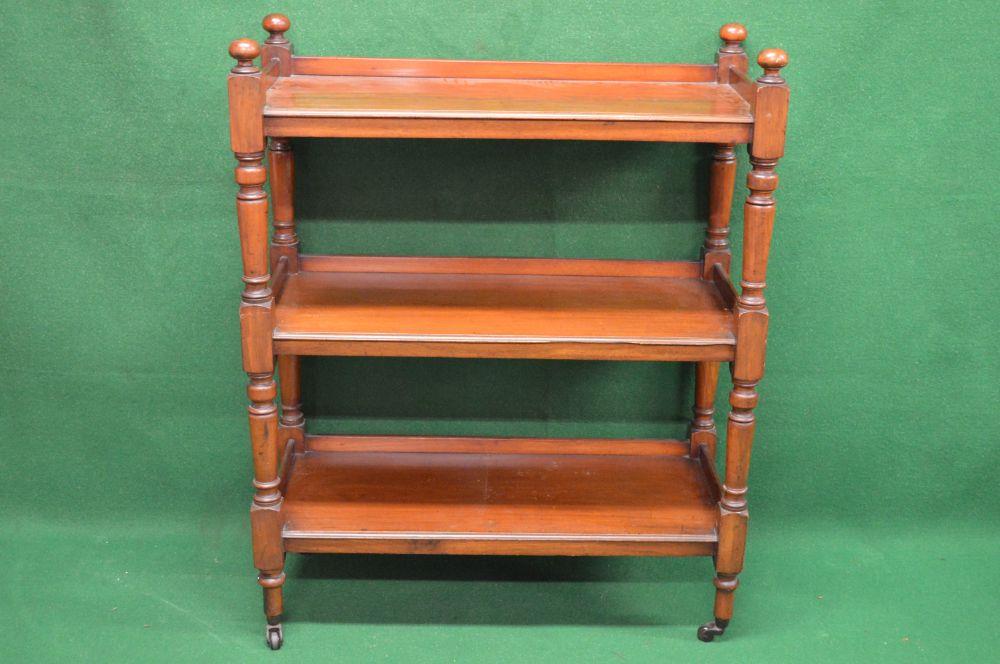 Victorian mahogany three tier buffet having 3/4 raised gallery with turned finials, each tier