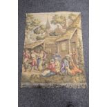 Late 20th century wall hanging tapestry depicting figures in a village setting, with bottom