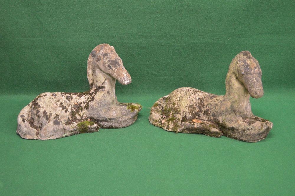 Pair of late 20th century weathered statues of recumbent horses - 16.5" tall Please note