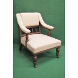 Walnut framed open armchair having padded back, buttoned arms and seat, standing on turned legs