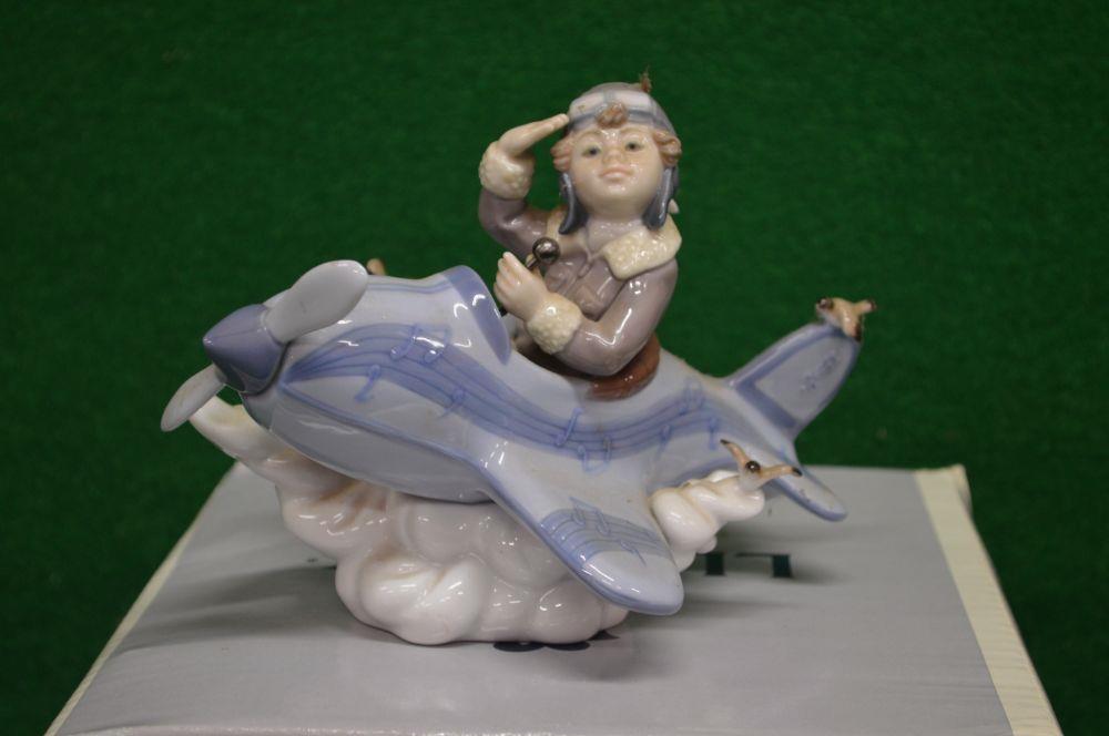 Lladro figure No. 5697 of a young boy flying an aeroplane, with original box - 5.5" tall Please note - Image 2 of 3