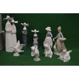 Group of nine Lladro figures together with one Nao figure to include: three nuns, two geese, two
