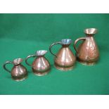 Four graduated copper jugs to comprise: two gallon, one gallon, half gallon and quart Please note