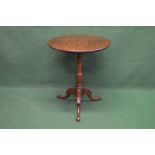 19th century mahogany circular tripod table the top supported by a turned column leading to a tripod