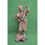 Painted spelter figure playing a stringed instrument, standing on square base - 23" tall Please note