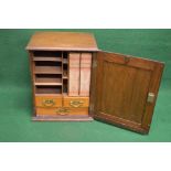 Oak desk top stationery cabinet having single door opening to reveal fitted interior of pigeon holes