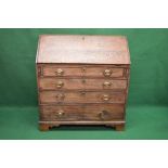 Georgian oak bureau having fall front opening to reveal fitted interior of pigeon holes and