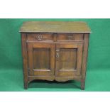 Oak side cabinet having two short drawers over two cupboard doors, standing on shaped moulded legs -
